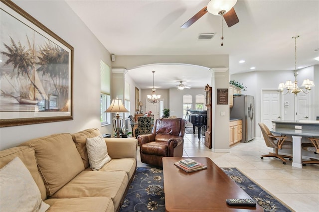 1415 Millbrook Cir, Bradenton, FL 34212 - living area with a ceiling fan, a chandelier, ornate columns, light tile patterned floors, and arched walkways