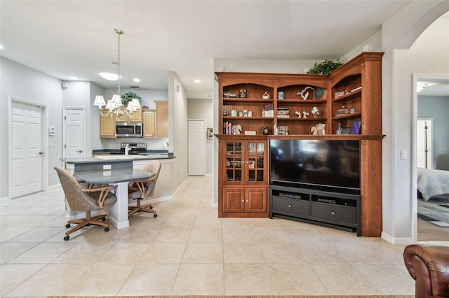 1415 Millbrook Cir, Bradenton, FL 34212 - living area with recessed lighting, light tile patterned floors, a chandelier, and arched walkways