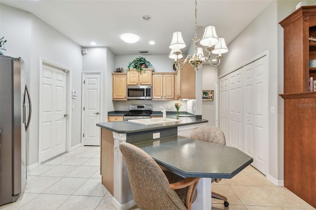 1415 Millbrook Cir, Bradenton, FL 34212 - kitchen with stainless steel appliances, dark countertops, light tile patterned flooring, a chandelier, and recessed lighting