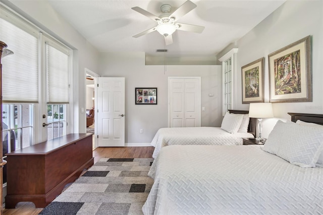 1415 Millbrook Cir, Bradenton, FL 34212 - bedroom featuring wood finished floors, a closet, and ceiling fan