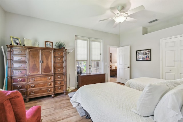 1415 Millbrook Cir, Bradenton, FL 34212 - bedroom with a closet, light wood-style floors, and a ceiling fan