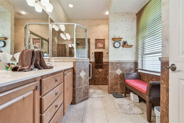 1415 Millbrook Cir, Bradenton, FL 34212 - full bath with tile walls, vanity, a stall shower, tile patterned floors, and wainscoting