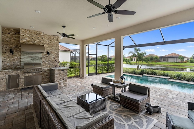4735 Cassio Ct, Bradenton, FL 34211 - view of patio / terrace with exterior kitchen, outdoor lounge area, ceiling fan, and a water view