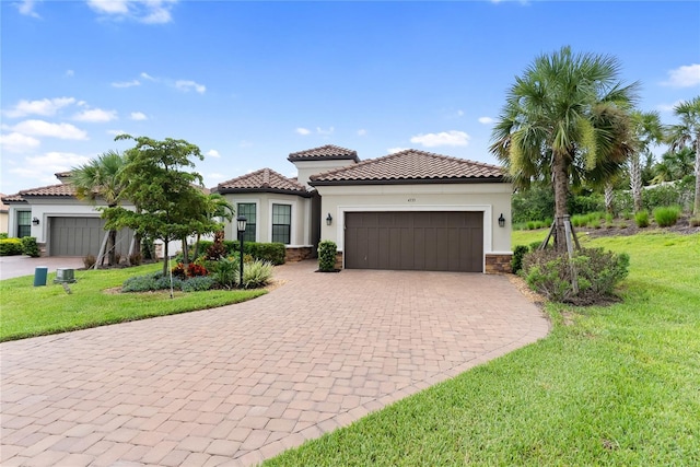 4735 Cassio Ct, Bradenton, FL 34211 - mediterranean / spanish-style house with a garage, a front lawn, driveway, and stucco siding