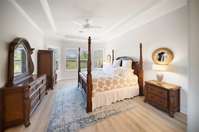 4735 Cassio Ct, Bradenton, FL 34211 - bedroom with a raised ceiling, light wood-style floors, crown molding, and a ceiling fan