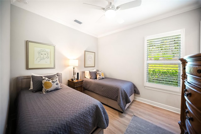 4735 Cassio Ct, Bradenton, FL 34211 - bedroom with light wood-type flooring, ornamental molding, and a ceiling fan