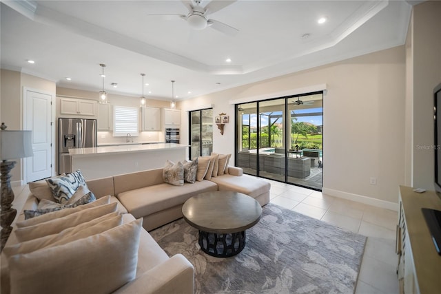 4735 Cassio Ct, Bradenton, FL 34211 - living area featuring ceiling fan, recessed lighting, light tile patterned floors, a tray ceiling, and ornamental molding