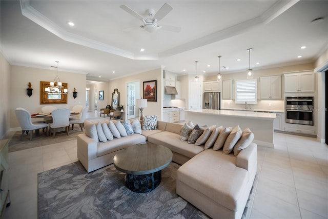 4735 Cassio Ct, Bradenton, FL 34211 - living area featuring light tile patterned floors, recessed lighting, a raised ceiling, a chandelier, and a ceiling fan