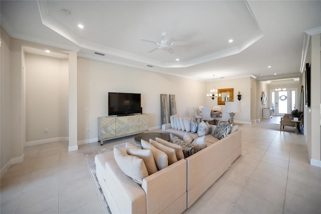 4735 Cassio Ct, Bradenton, FL 34211 - living room with a tray ceiling, a chandelier, recessed lighting, crown molding, and ceiling fan