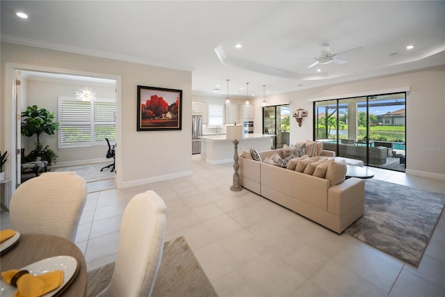 4735 Cassio Ct, Bradenton, FL 34211 - living area with healthy amount of natural light, a ceiling fan, a raised ceiling, recessed lighting, and ornamental molding