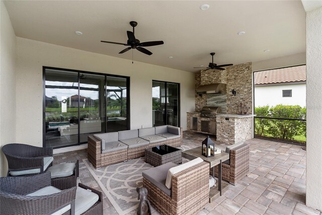 4735 Cassio Ct, Bradenton, FL 34211 - view of patio / terrace featuring exterior kitchen, a ceiling fan, and outdoor lounge area