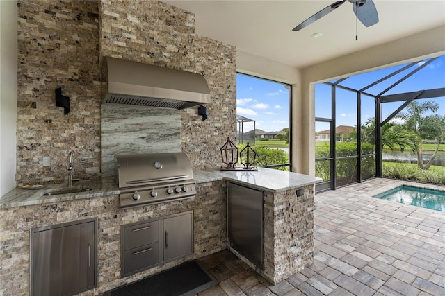 4735 Cassio Ct, Bradenton, FL 34211 - view of patio / terrace featuring an outdoor kitchen, ceiling fan, and a lanai