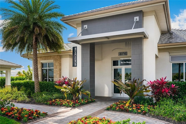 4735 Cassio Ct, Bradenton, FL 34211 - property entrance with a tile roof and stucco siding