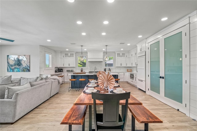 119 Avenida Messina, Sarasota, FL 34242 - dining space with light wood-style flooring and recessed lighting
