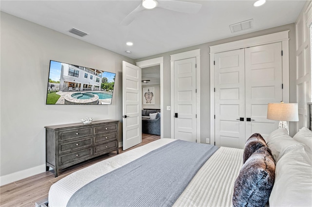 119 Avenida Messina, Sarasota, FL 34242 - bedroom with wood finished floors, recessed lighting, a ceiling fan, and a closet