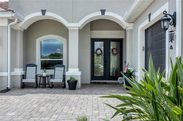 16038 39th Gln E, Parrish, FL 34219 - doorway to property featuring stucco siding and french doors