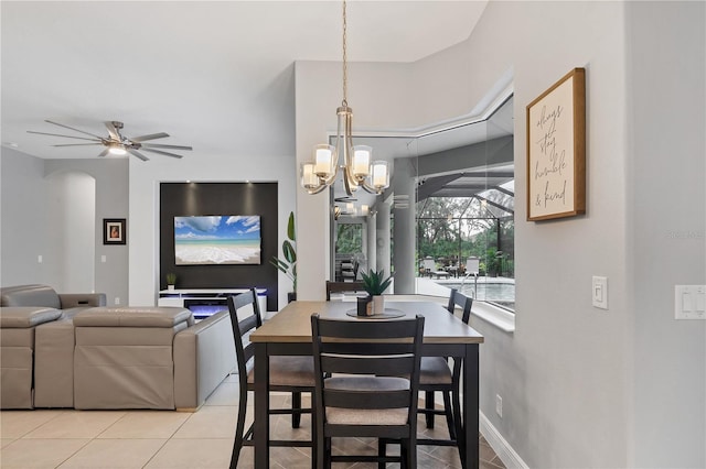 16038 39th Gln E, Parrish, FL 34219 - dining area featuring light tile patterned floors, a chandelier, a ceiling fan, and arched walkways