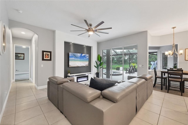 16038 39th Gln E, Parrish, FL 34219 - living area featuring ceiling fan, light tile patterned floors, arched walkways, and a chandelier