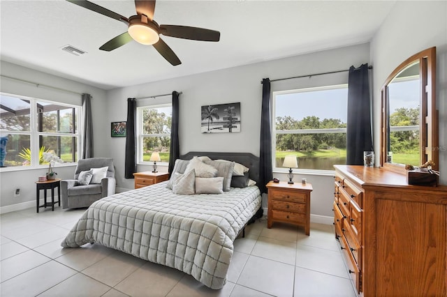 16038 39th Gln E, Parrish, FL 34219 - bedroom with light tile patterned floors and ceiling fan