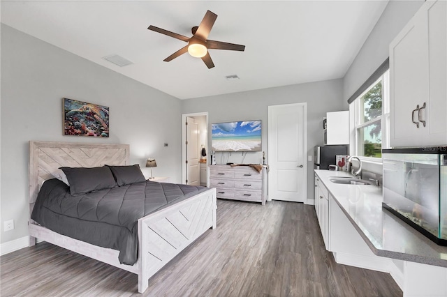 16038 39th Gln E, Parrish, FL 34219 - bedroom with dark wood-style floors and a ceiling fan