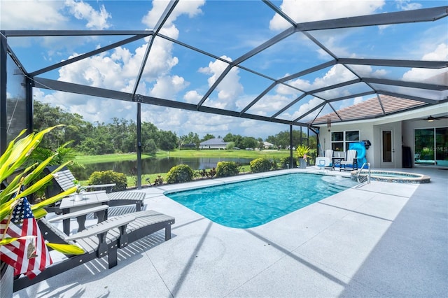 16038 39th Gln E, Parrish, FL 34219 - view of swimming pool with a patio area, a water view, glass enclosure, and a pool with connected hot tub