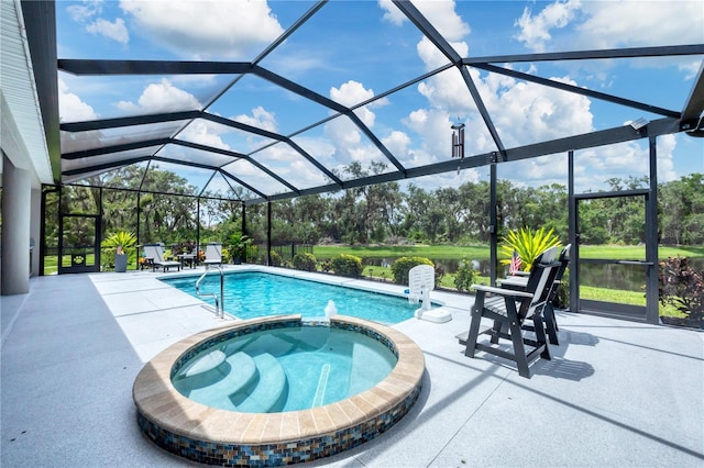 16038 39th Gln E, Parrish, FL 34219 - view of swimming pool featuring a patio area, a pool with connected hot tub, glass enclosure, and view of scattered trees