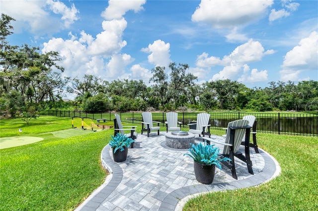 16038 39th Gln E, Parrish, FL 34219 - view of patio with a putting area, an outdoor fire pit, and view of scattered trees