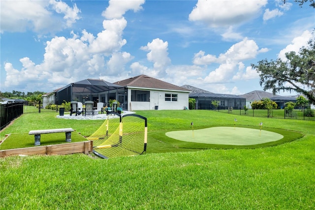 16038 39th Gln E, Parrish, FL 34219 - view of property's community with a putting green, a fenced backyard, and a patio area