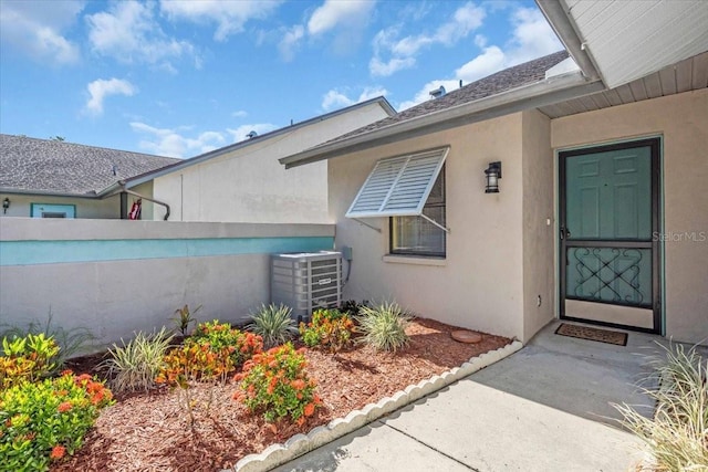 327 40th Ct W, Palmetto, FL 34221 - doorway to property with stucco siding