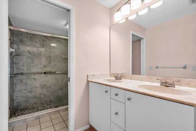 327 40th Ct W, Palmetto, FL 34221 - full bathroom with double vanity, a shower stall, and tile patterned flooring