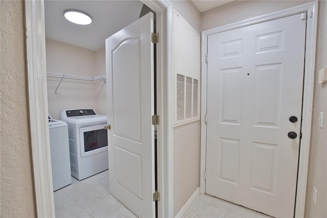4140 Central Sarasota Pkwy Unit 1235, Sarasota, FL 34238 - laundry area with separate washer and dryer and light tile patterned floors