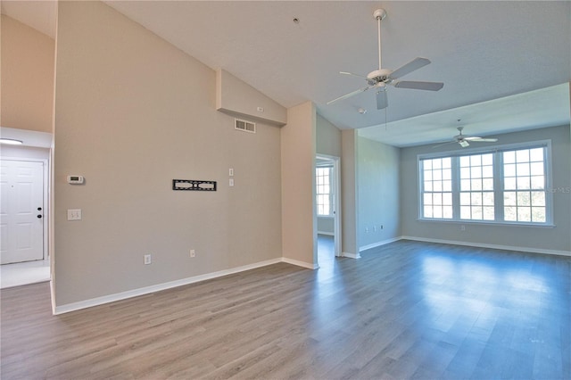 4140 Central Sarasota Pkwy Unit 1235, Sarasota, FL 34238 - unfurnished room with a ceiling fan, wood finished floors, and high vaulted ceiling