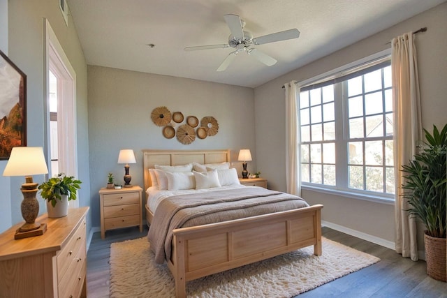 4140 Central Sarasota Pkwy Unit 1235, Sarasota, FL 34238 - bedroom with wood finished floors and a ceiling fan