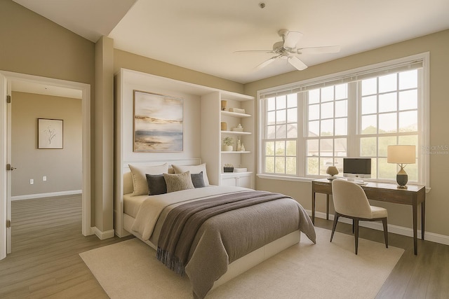 4140 Central Sarasota Pkwy Unit 1235, Sarasota, FL 34238 - bedroom featuring light wood-style flooring, a desk, and a ceiling fan