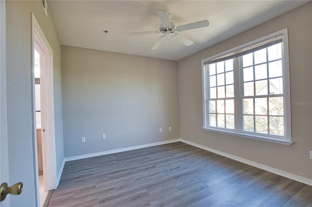 4140 Central Sarasota Pkwy Unit 1235, Sarasota, FL 34238 - empty room with wood finished floors and ceiling fan