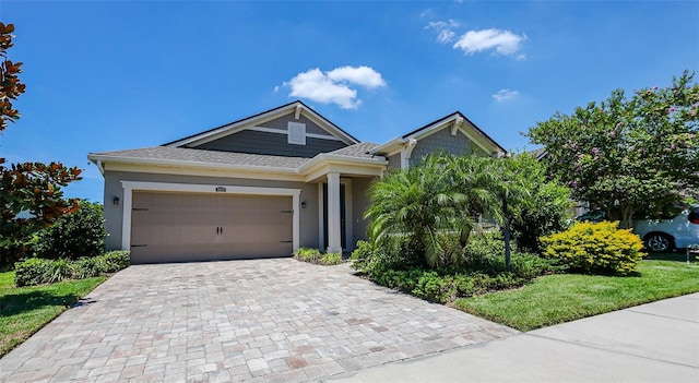 11223 Spring Gate Trl, Bradenton, FL 34211 - view of front of home featuring driveway, an attached garage, and stucco siding