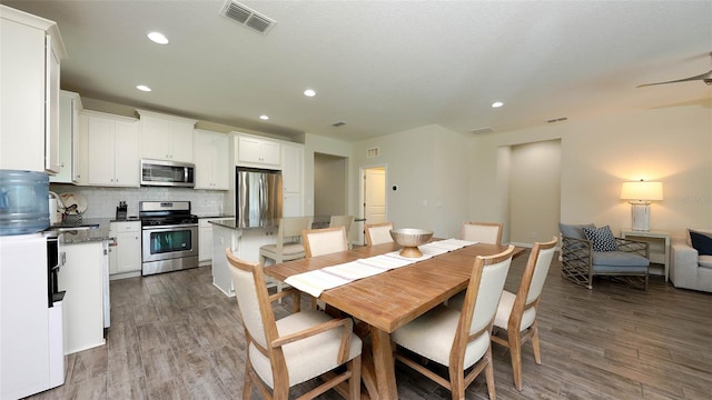 11223 Spring Gate Trl, Bradenton, FL 34211 - dining room with dark wood-style flooring and recessed lighting