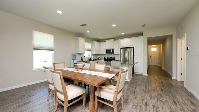 11223 Spring Gate Trl, Bradenton, FL 34211 - dining room featuring wood finished floors and recessed lighting