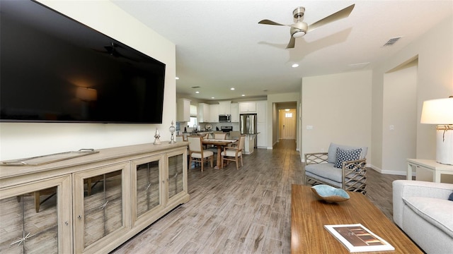 11223 Spring Gate Trl, Bradenton, FL 34211 - living area with light wood-style floors, a ceiling fan, and recessed lighting
