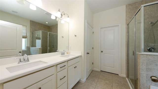11223 Spring Gate Trl, Bradenton, FL 34211 - full bathroom featuring tile patterned flooring, double vanity, and a stall shower