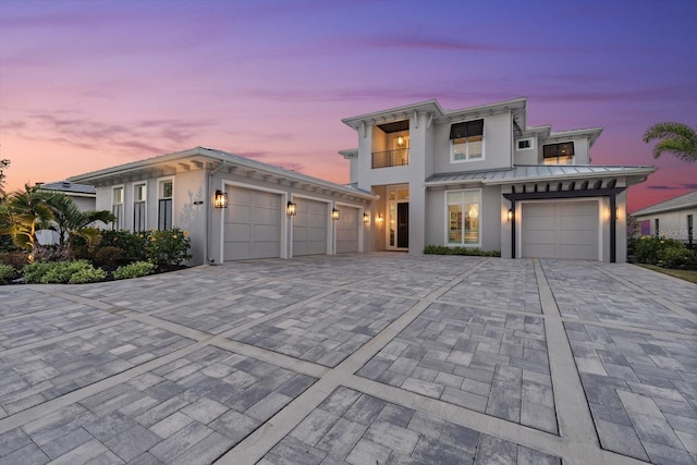 676 Regatta Way, Bradenton, FL 34208 - view of front of property with decorative driveway, a balcony, a garage, and stucco siding