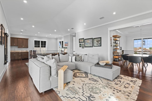 676 Regatta Way, Bradenton, FL 34208 - living area with dark wood finished floors, recessed lighting, and ornamental molding