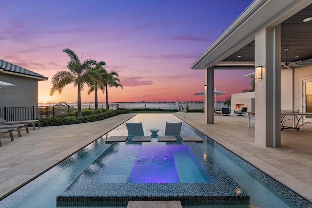 676 Regatta Way, Bradenton, FL 34208 - view of pool featuring a patio area, a pool with connected hot tub, and a ceiling fan