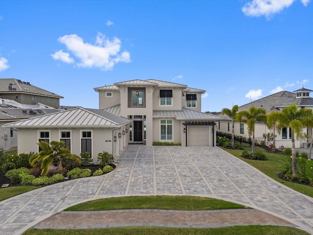 676 Regatta Way, Bradenton, FL 34208 - modern farmhouse style home with a standing seam roof, a metal roof, and decorative driveway