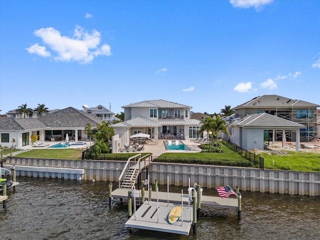676 Regatta Way, Bradenton, FL 34208 - dock with a water view, a patio, an outdoor pool, and boat lift