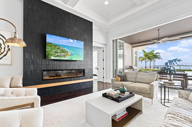 676 Regatta Way, Bradenton, FL 34208 - living room with wood finished floors, a fireplace, recessed lighting, and a ceiling fan