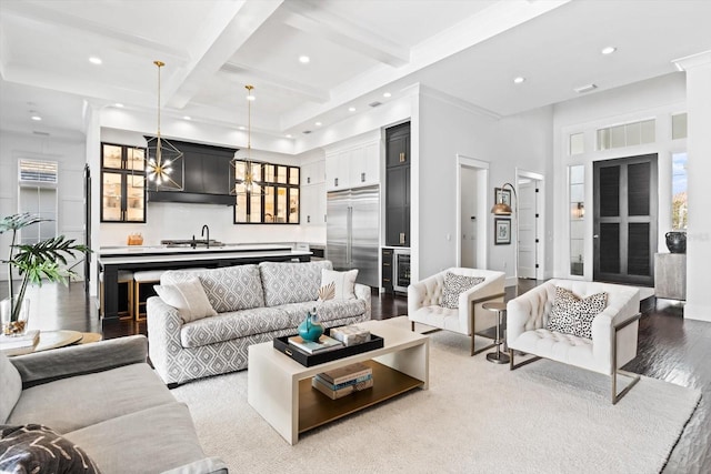 676 Regatta Way, Bradenton, FL 34208 - living room with light wood-style floors, beam ceiling, wine cooler, coffered ceiling, and recessed lighting