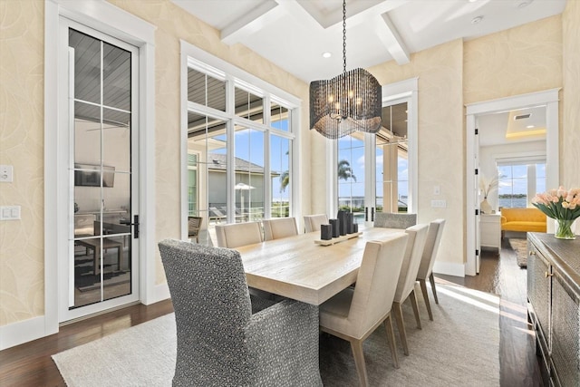 676 Regatta Way, Bradenton, FL 34208 - dining space with dark wood-style flooring, a chandelier, coffered ceiling, and beam ceiling