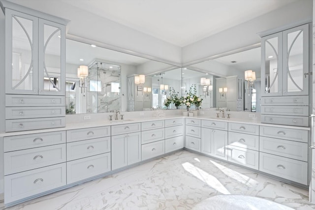 676 Regatta Way, Bradenton, FL 34208 - bathroom featuring marble finish floors, a marble finish shower, double vanity, and recessed lighting