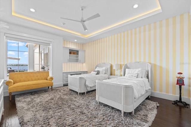676 Regatta Way, Bradenton, FL 34208 - bedroom featuring a raised ceiling, dark wood finished floors, recessed lighting, and ceiling fan